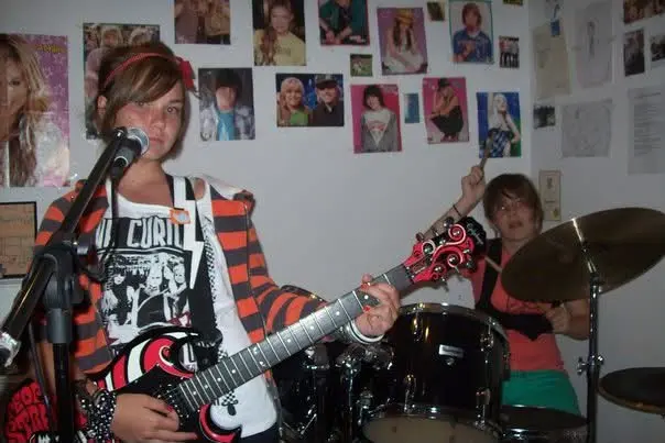 An image of Sarah in her band. A woman in the music industry.